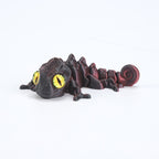 3D printed chameleon lizard with movable joints - a popular realistic pet model gift for kids, a funny toy, for sale at a stall.