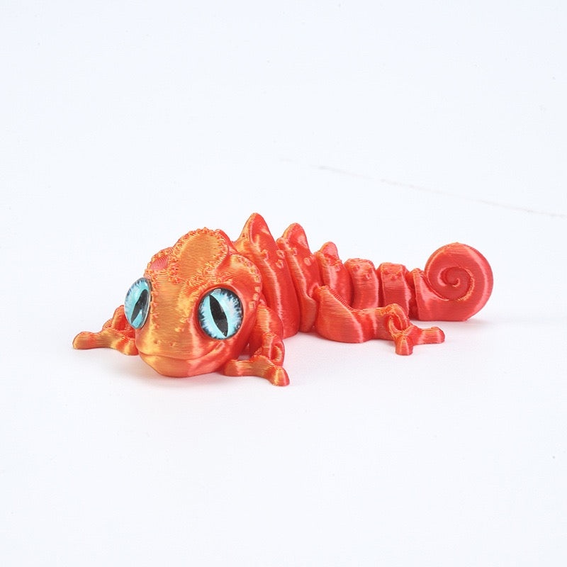 3D printed chameleon lizard with movable joints - a popular realistic pet model gift for kids, a funny toy, for sale at a stall.