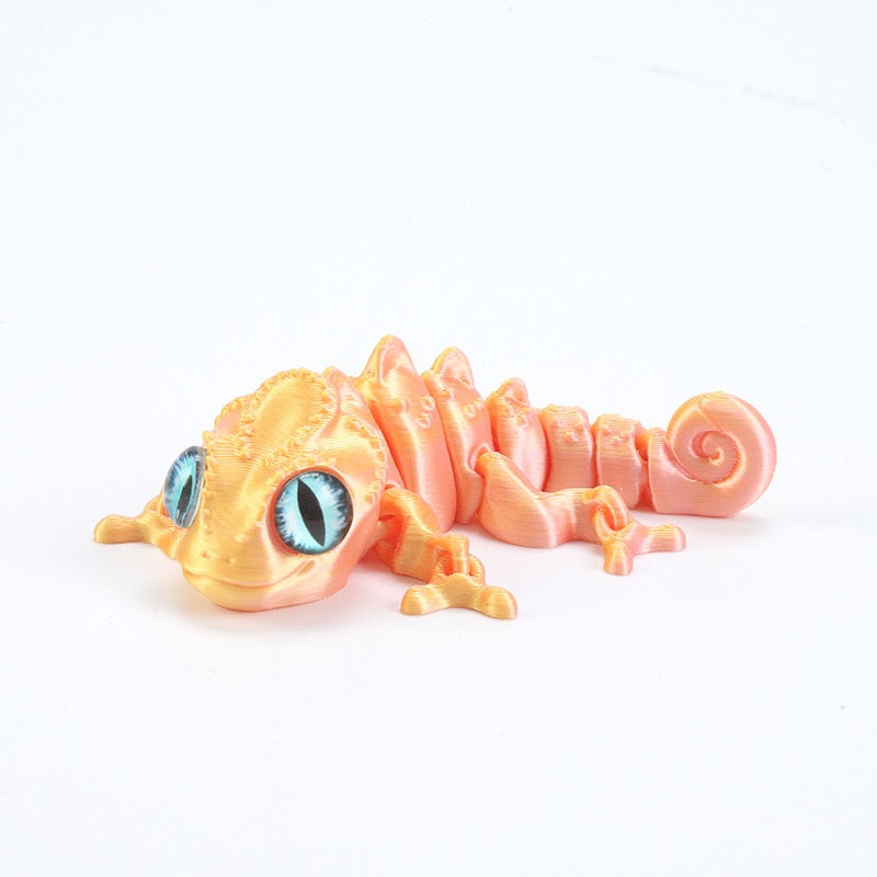 3D printed chameleon lizard with movable joints - a popular realistic pet model gift for kids, a funny toy, for sale at a stall.
