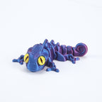 3D printed chameleon lizard with movable joints - a popular realistic pet model gift for kids, a funny toy, for sale at a stall.
