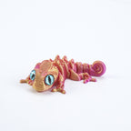 3D printed chameleon lizard with movable joints - a popular realistic pet model gift for kids, a funny toy, for sale at a stall.