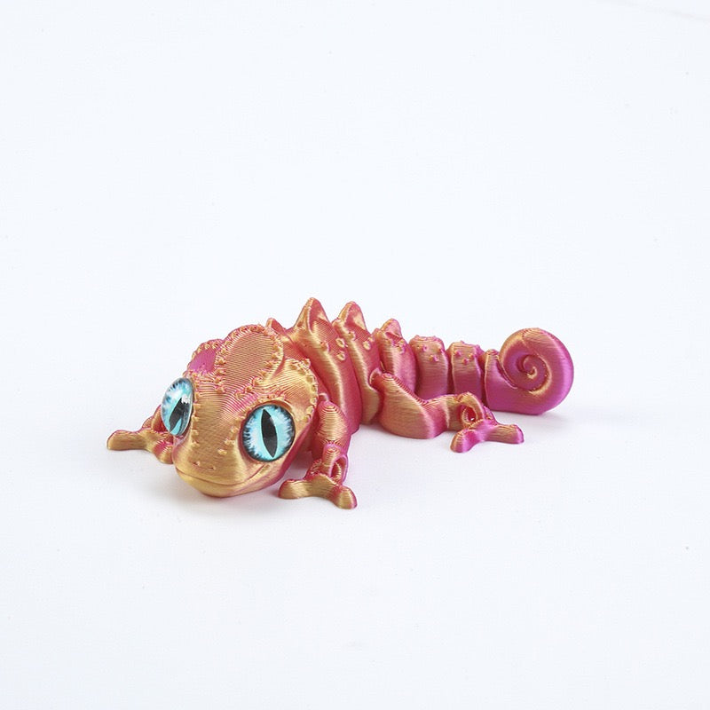 3D printed chameleon lizard with movable joints - a popular realistic pet model gift for kids, a funny toy, for sale at a stall.