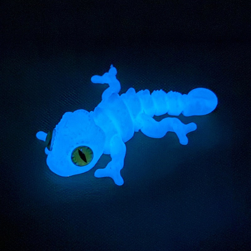 3D printed chameleon lizard with movable joints - a popular realistic pet model gift for kids, a funny toy, for sale at a stall.