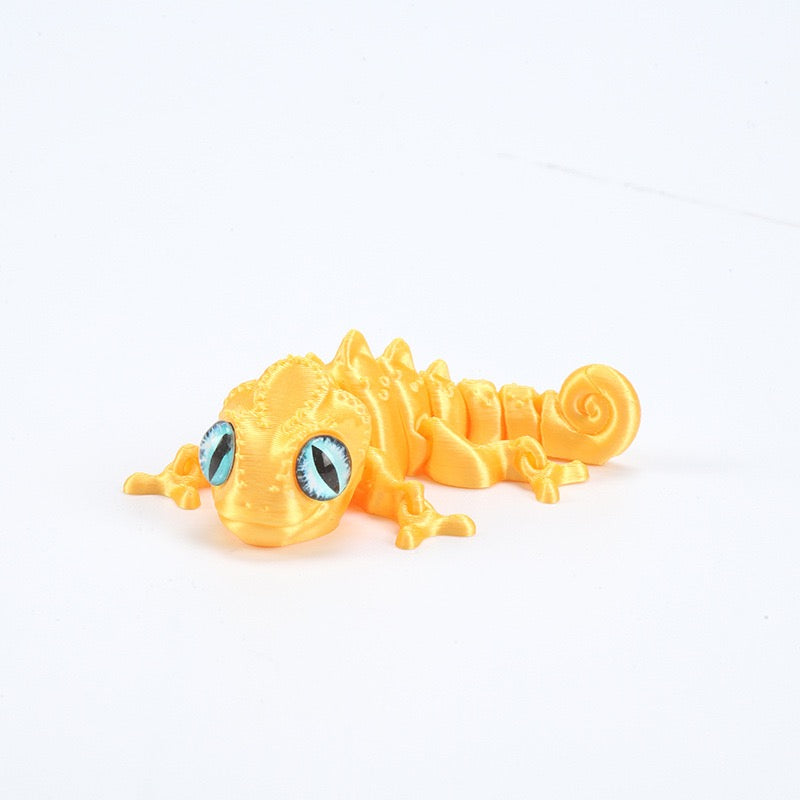 3D printed chameleon lizard with movable joints - a popular realistic pet model gift for kids, a funny toy, for sale at a stall.