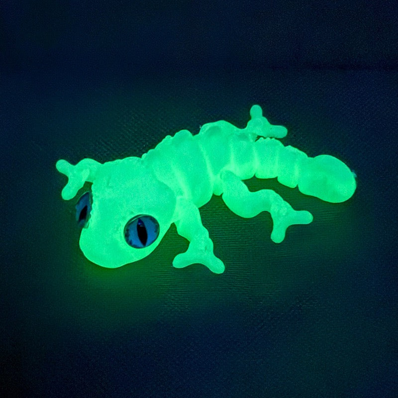 3D printed chameleon lizard with movable joints - a popular realistic pet model gift for kids, a funny toy, for sale at a stall.